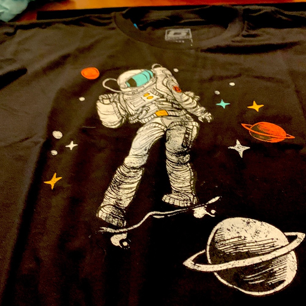 Black tshirt with solar system and astronaut.